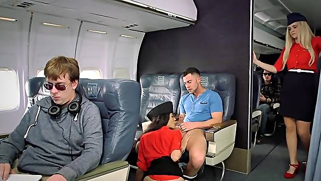 Amazing stewardess is giving oral pleasure to this passenger