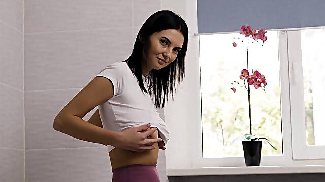 Brunette babe Simon Kay pleasures herself with her massive naturals in a steamy solo session